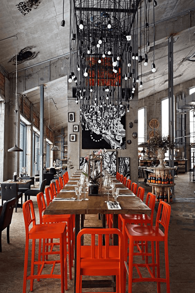 industrial style restaurant interior with red accents