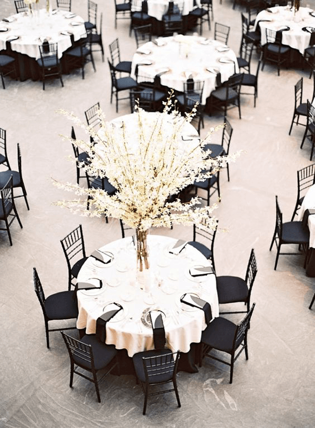 blush toned reception with black chairs