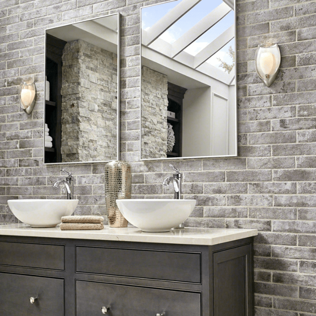 bathroom with taupe brick accent wall