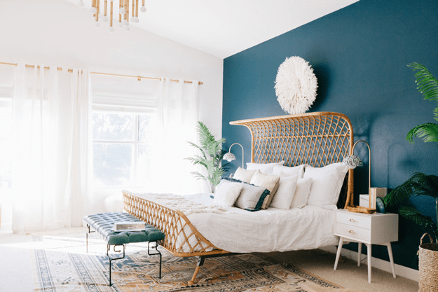 bohemian bedroom with peacock blue accent wall