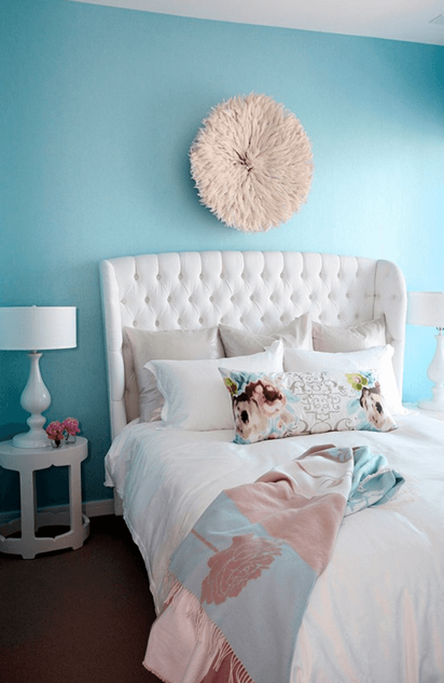 turquoise bedroom with white upholstered bed
