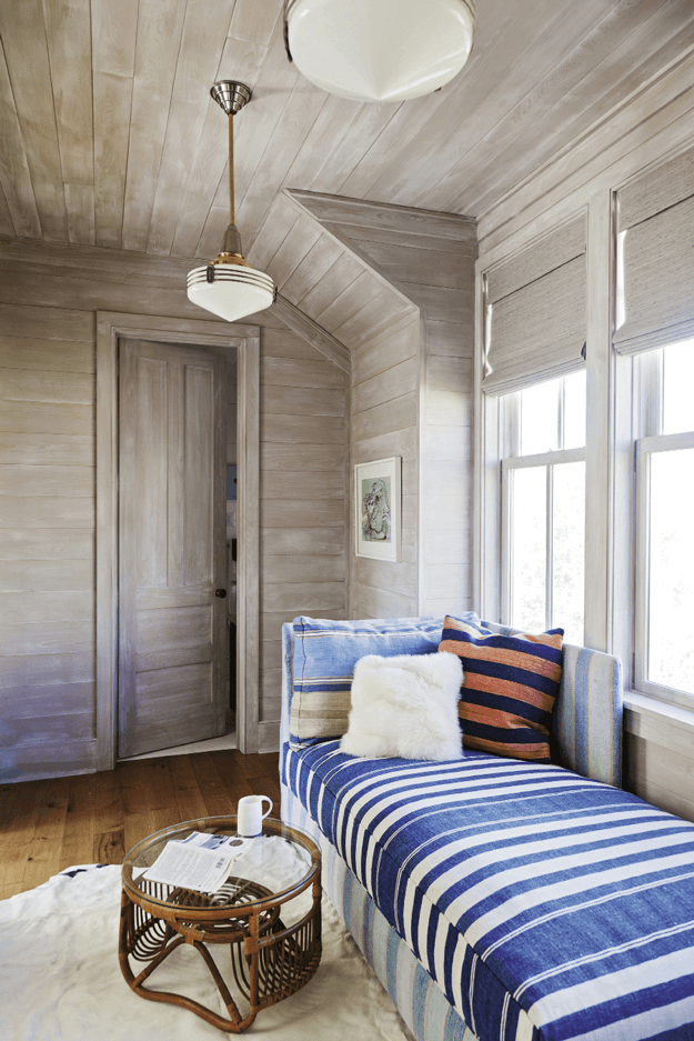 driftwood clad room with periwinkle blue accents