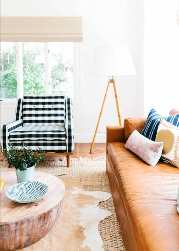 livingroomwithbeigecowhiderugsherwinwilliamstresnaturale