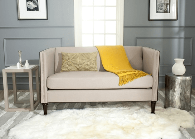 light taupe sofa with golden yellow accent