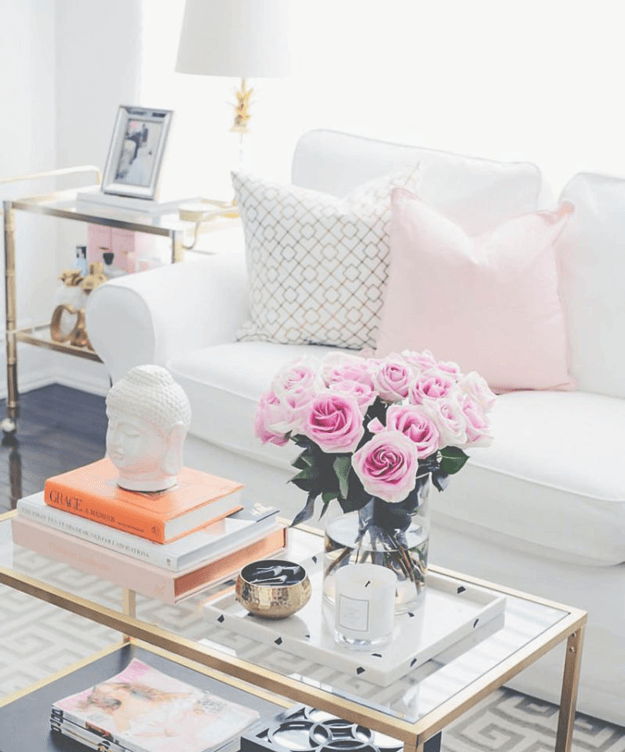 white dreamy living room with pink accents