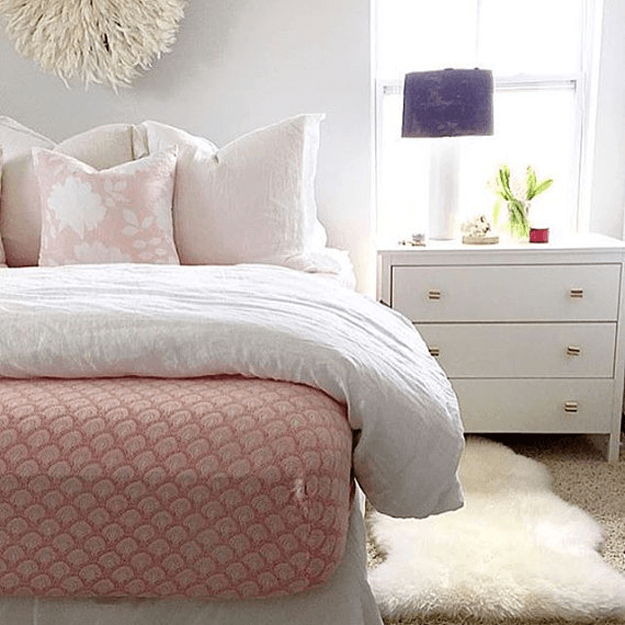 ivory sheepskin rug in blush bedroom