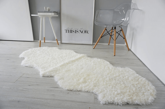 short curly sheepkin rug in gray modern room