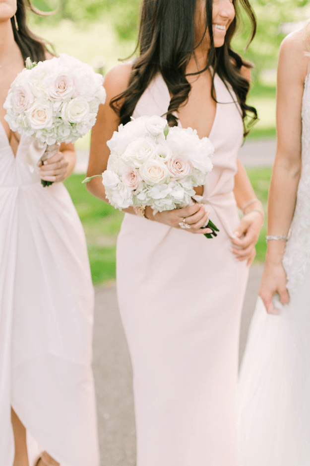 bridesmaids in pale pink dresses
