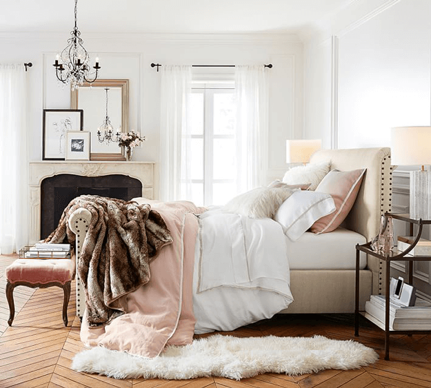 ivory sheepskin rug in traditional bedroom