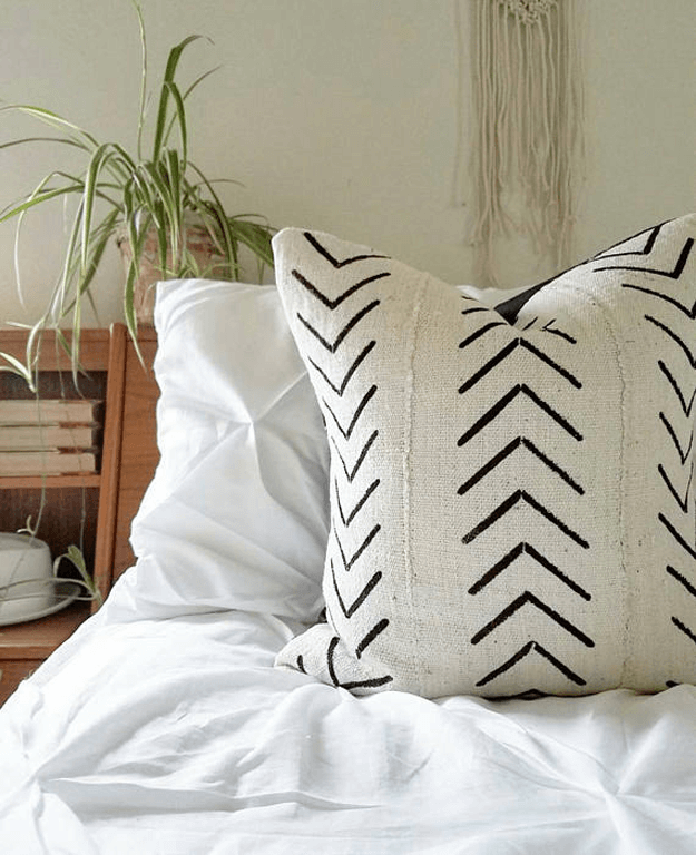 white african mudcloth tribal pillow on bed