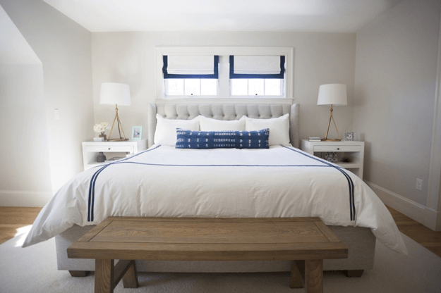 white bedroom with navy blue accents