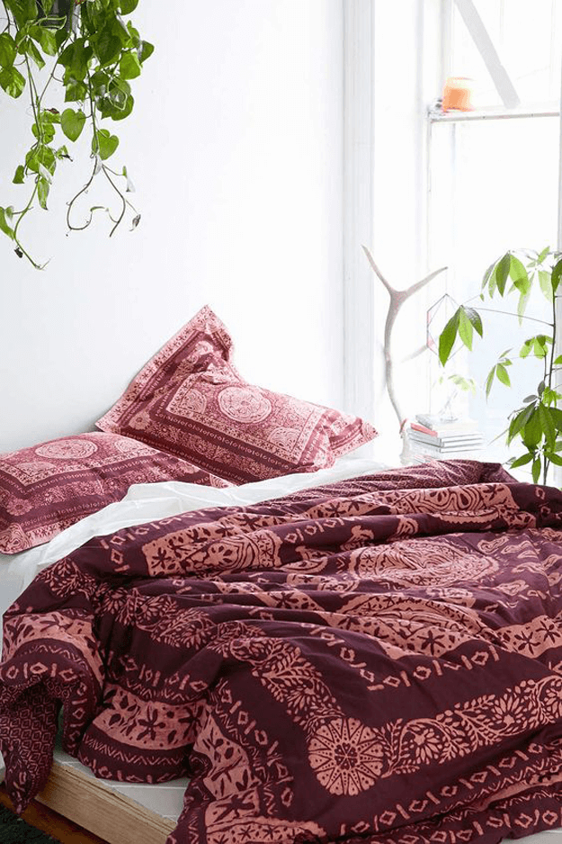 white bedroom with burgundy medallion comforter
