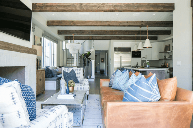 living room with camel brown leather sofa and denim blue accents