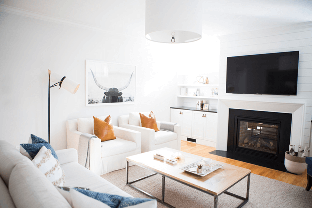 white living room with burnt orange and indigo accents