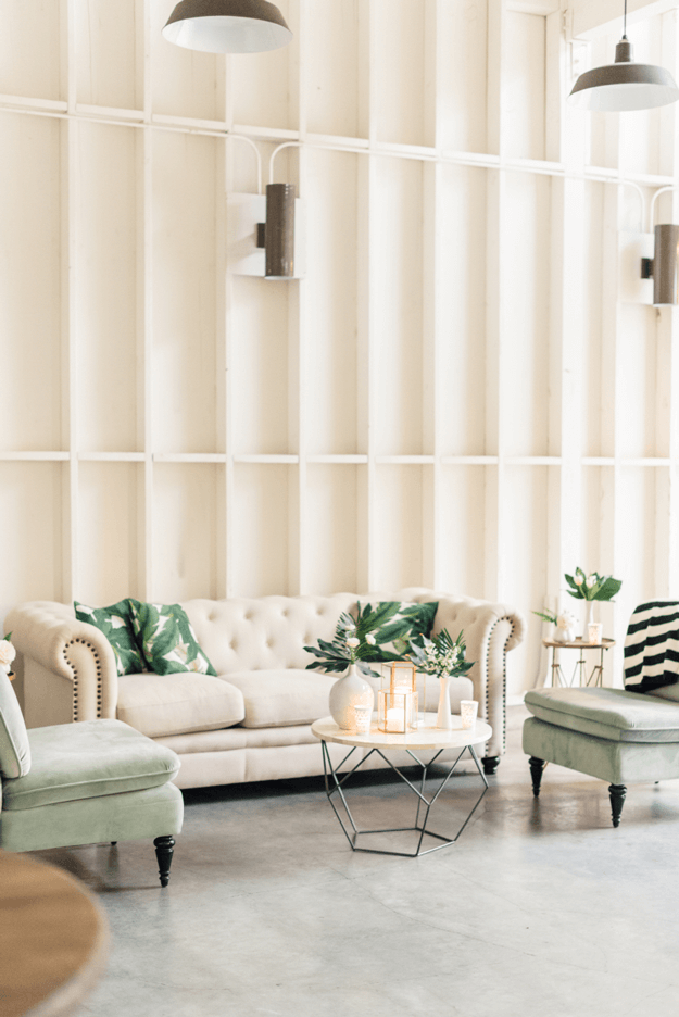 creamy white interior with banana leaf print pillows