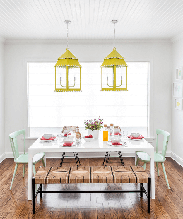eclectic dining room with lemon yellow lantern pendants