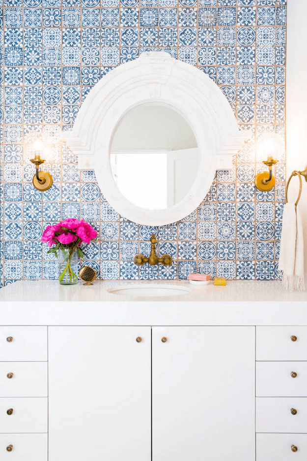 white bathroom with blue Moroccan tiles