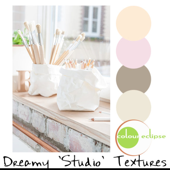 close-up of paint brushes with color palette