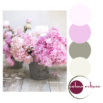 pink roses in rustic metal bucket