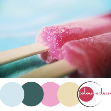 raspberry popsicle on turquoise background