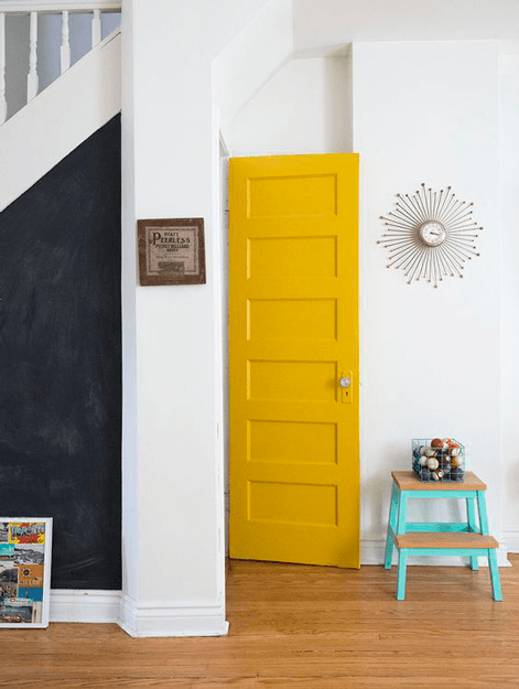 white interior with mustard yellow door