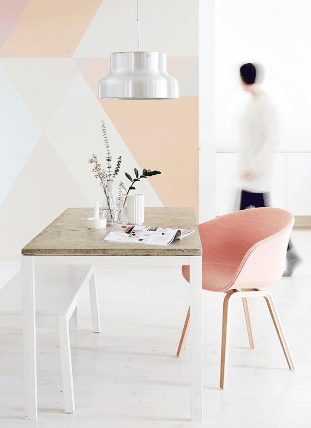 creamy white interior with peach geometric accent wall