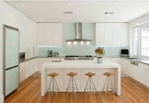 modern white kitchen with seafoam green backsplash