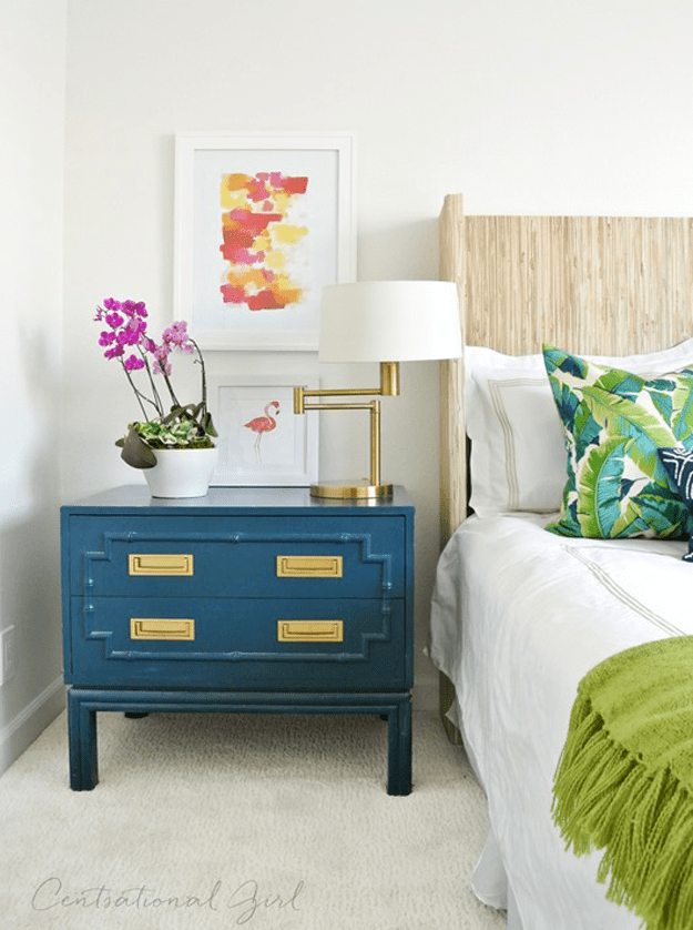 eclectic bedroom with peacock blue night stand