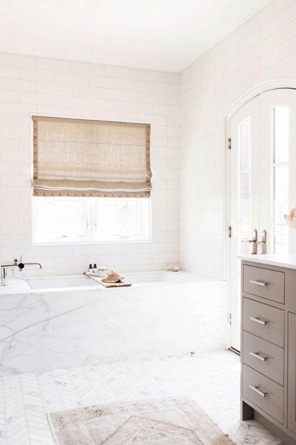 white bathroom with taupe vanity cabinets