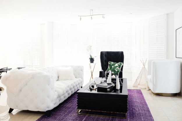 white living room with purple rug