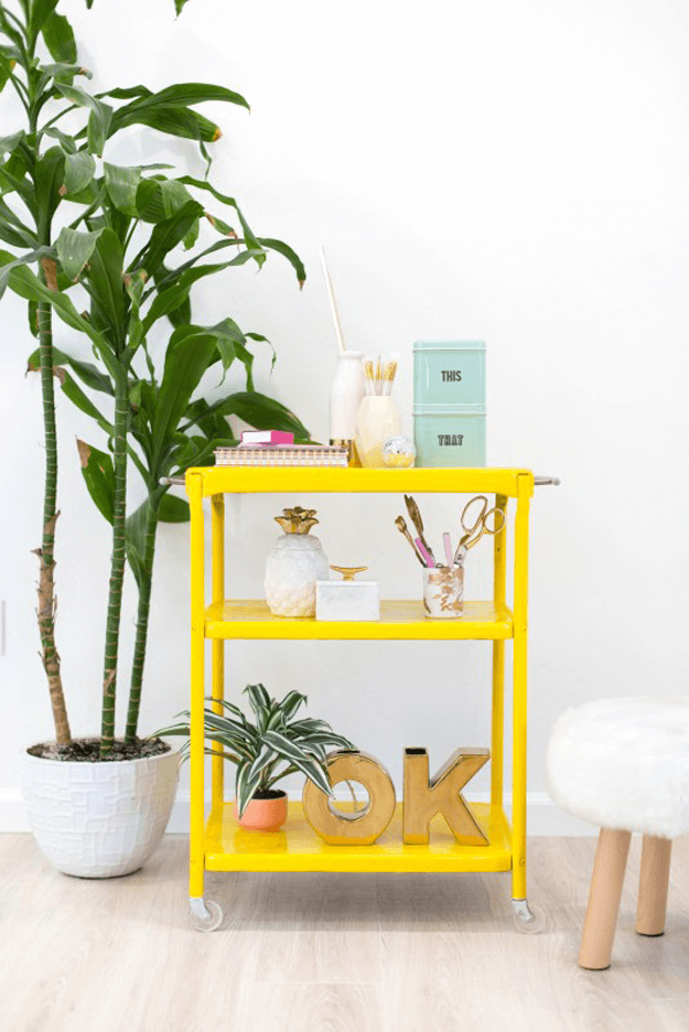 bright yellow cart in white room