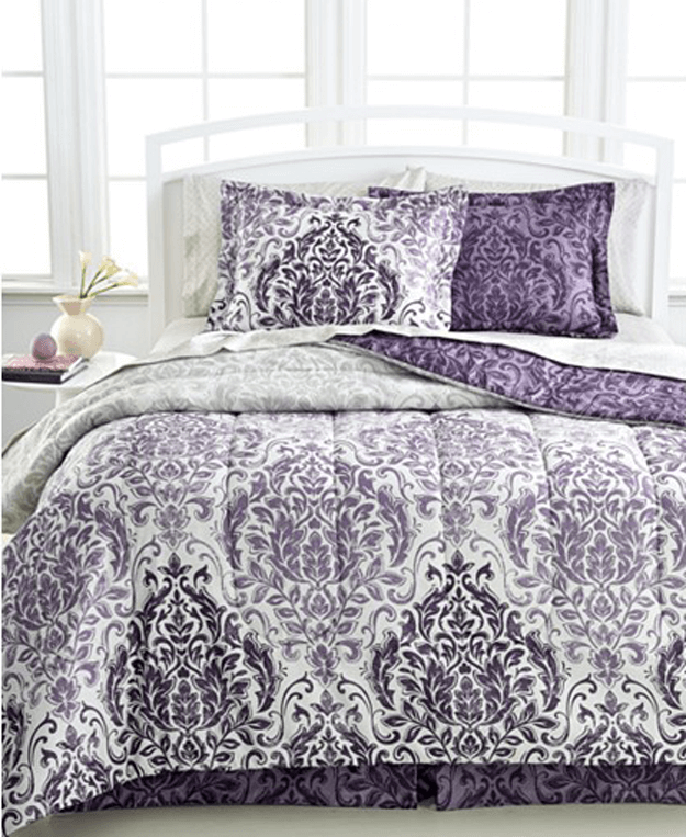 white bedroom with dark purple patterned bedding