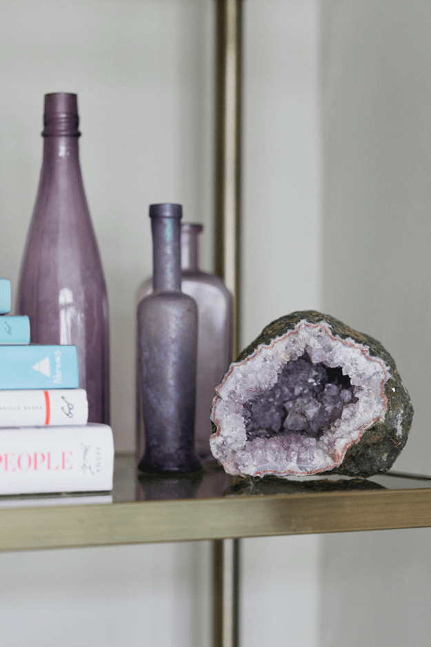 purple glass bottles on shelf