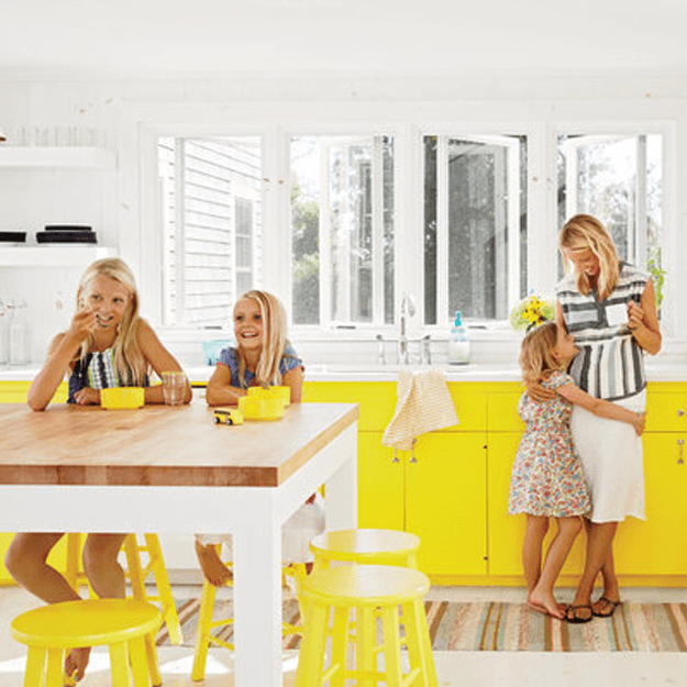 white kitchen with bright yellow base cabinets