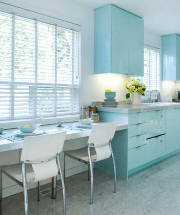 white kitchen with baby blue cabinets