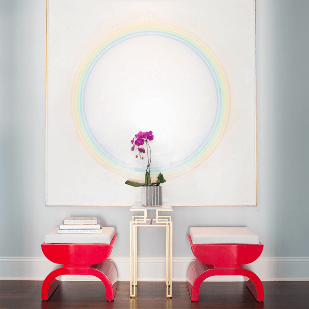 art deco style interior with bright red stools