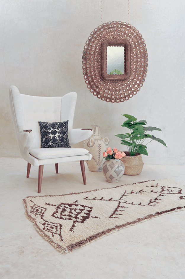 living room with light brown moroccan tribal rug