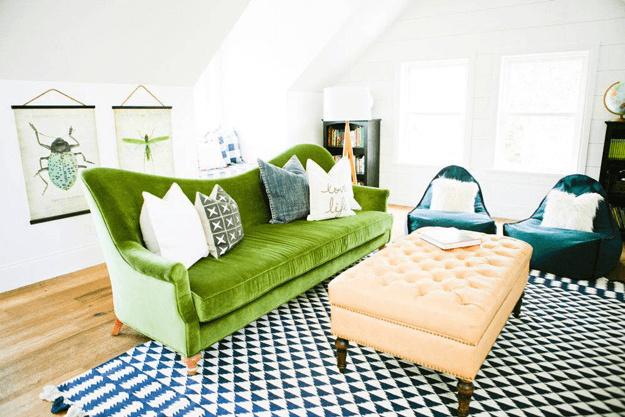 eclectic living room with moss green sofa