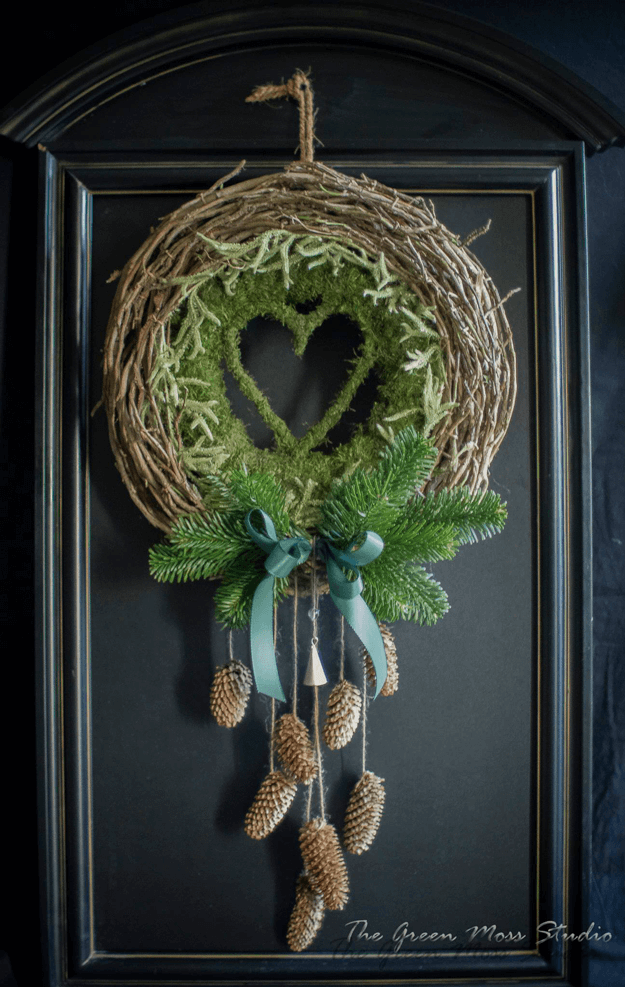 green moss wreath on black door