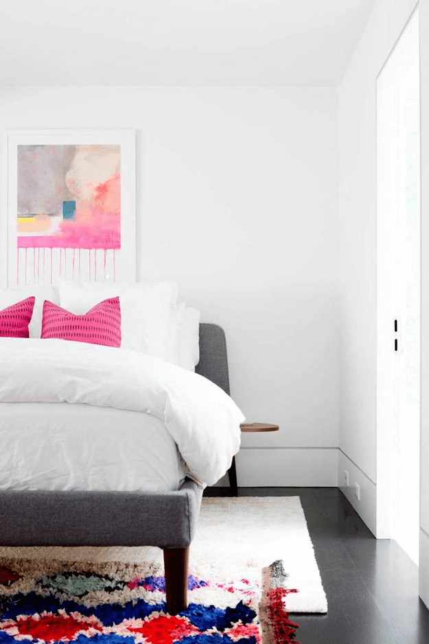 white bedroom with fuchsia accents