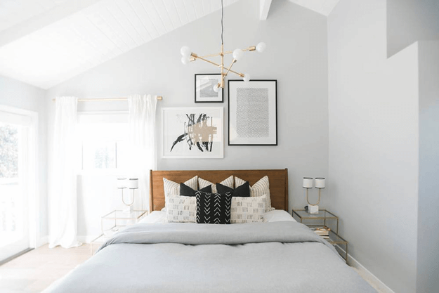 pale gray bedroom with light taupe wood floors