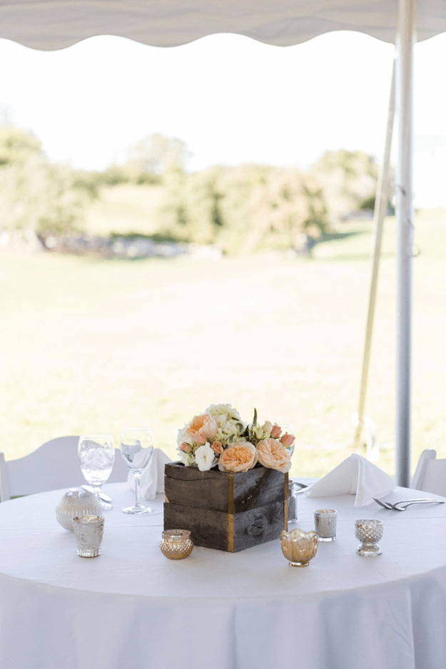 outdoor wedding with dark bronze wood centerpiece