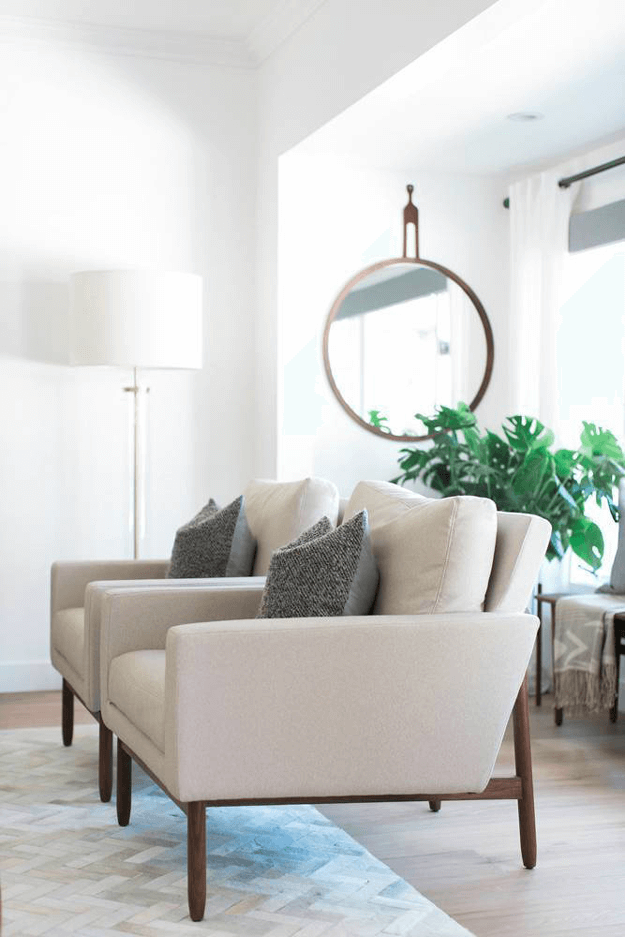 white living room with light taupe chairs