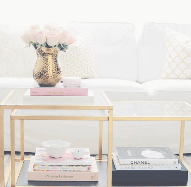 white sofa closeup with gold and pale pink accents