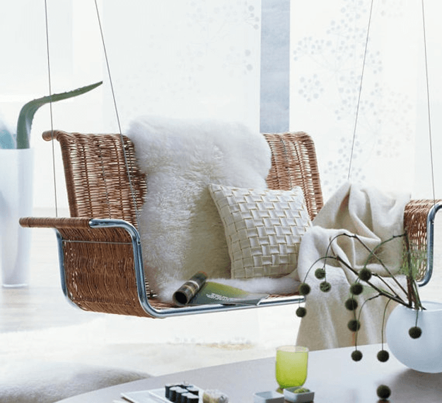 white sheepskin throw on rattan swing