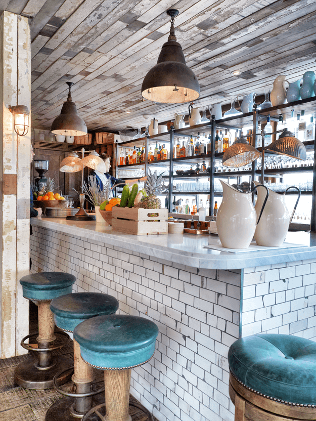 restaurant bar with teal green stools