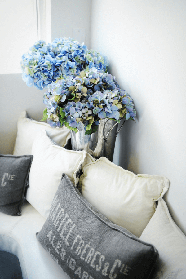 ivory and gray living room with blue flowers