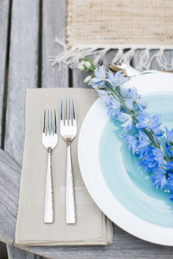 outdoor table setting with blue flowers