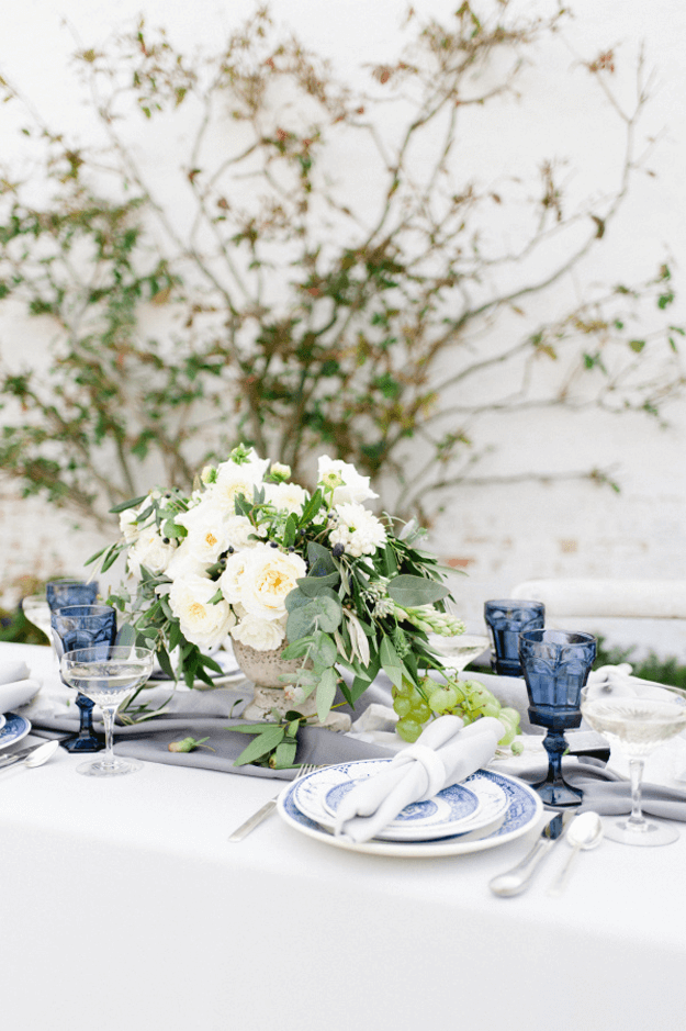 wedding reception table with cobalt blue glasses