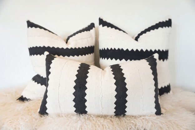 white mudcloth with black zig zag stripes pillow